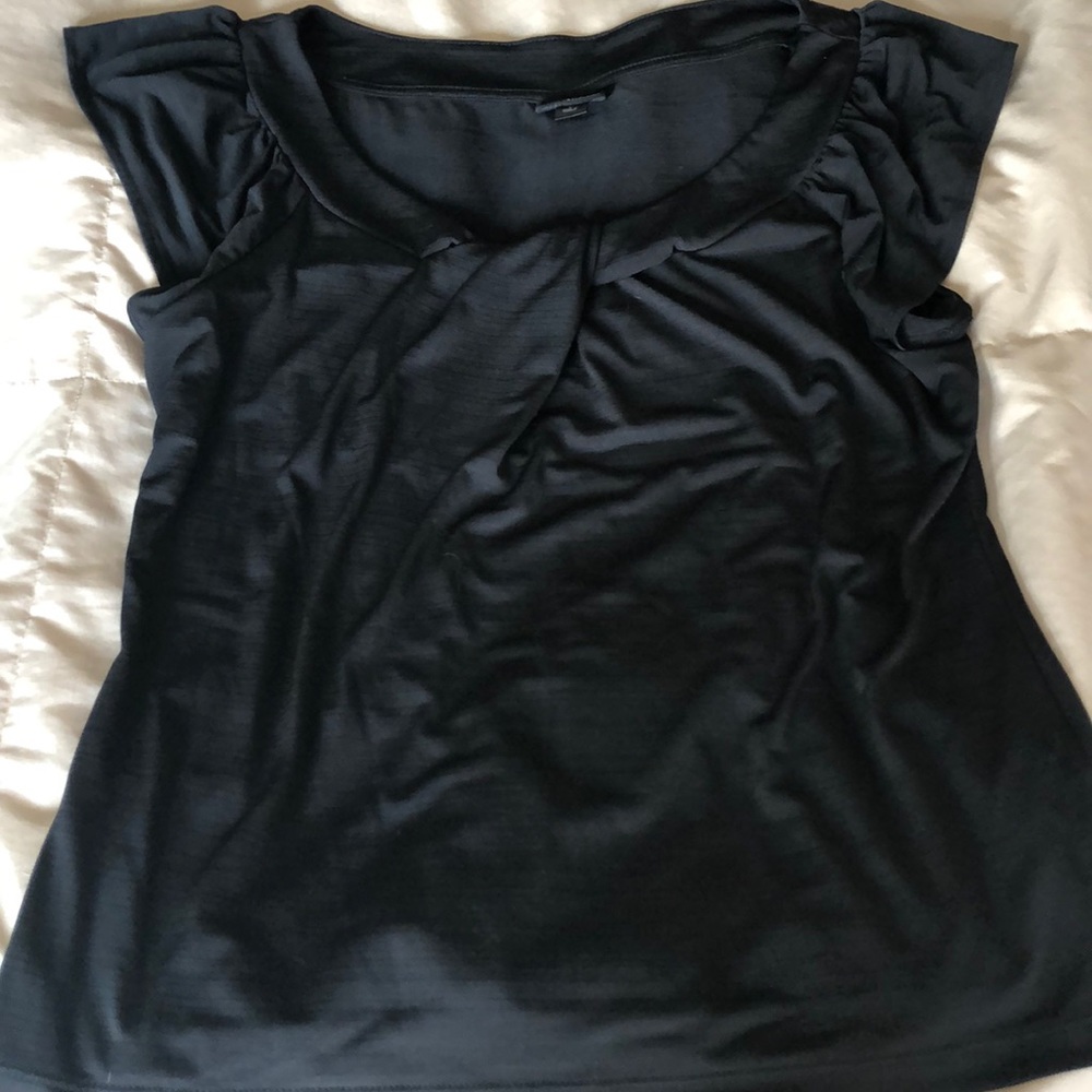 NWOT never worn large polyester shirt.